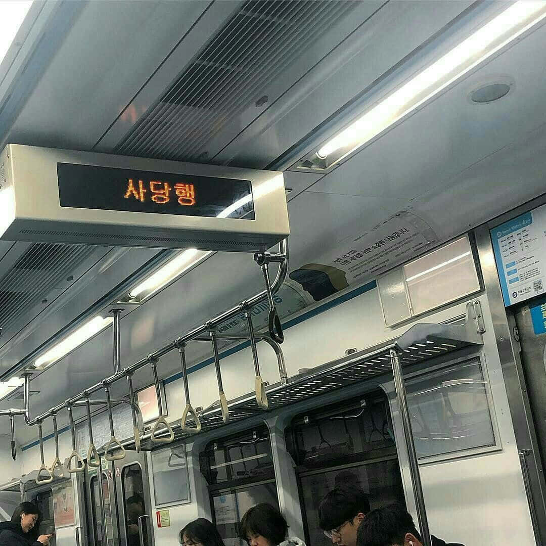 A Train With People Sitting On The Seats