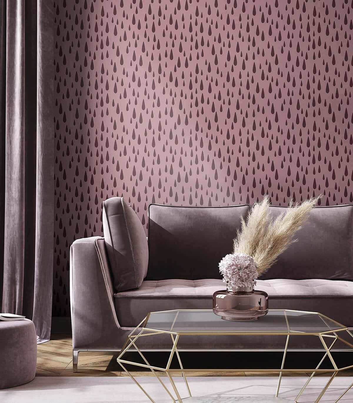 Et stue med en lyserød sofa og kaffebord Wallpaper