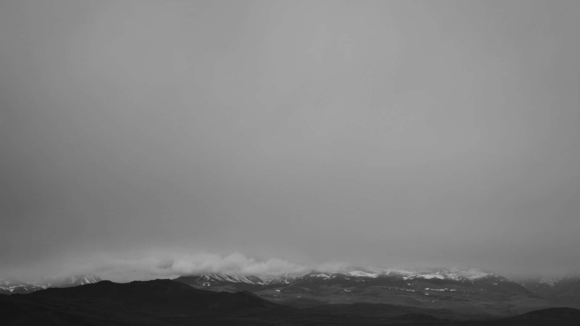 Foggy Mountain Range In Grey Desktop Wallpaper
