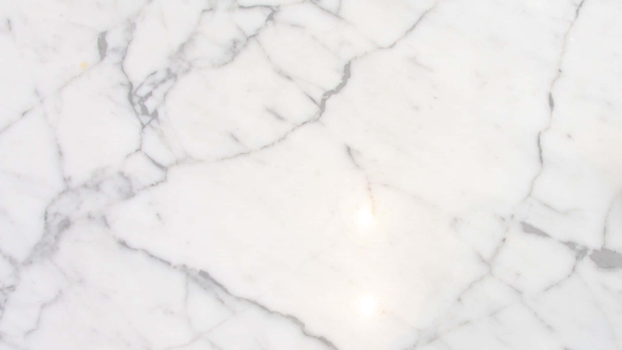 A White Marble Countertop With A White Marble Floor