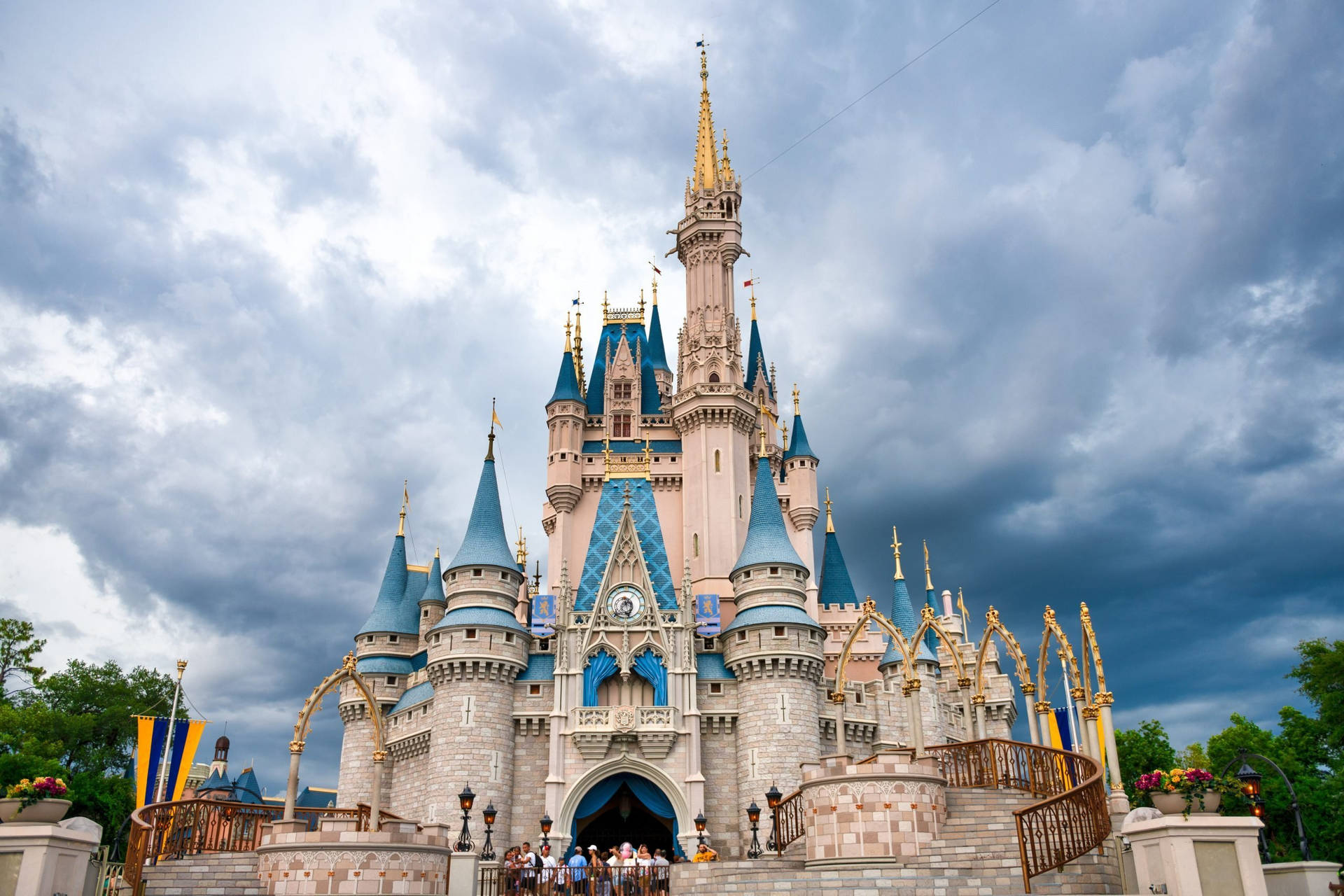 Enchanting Walt Disney Castle Under Grey Sky Wallpaper