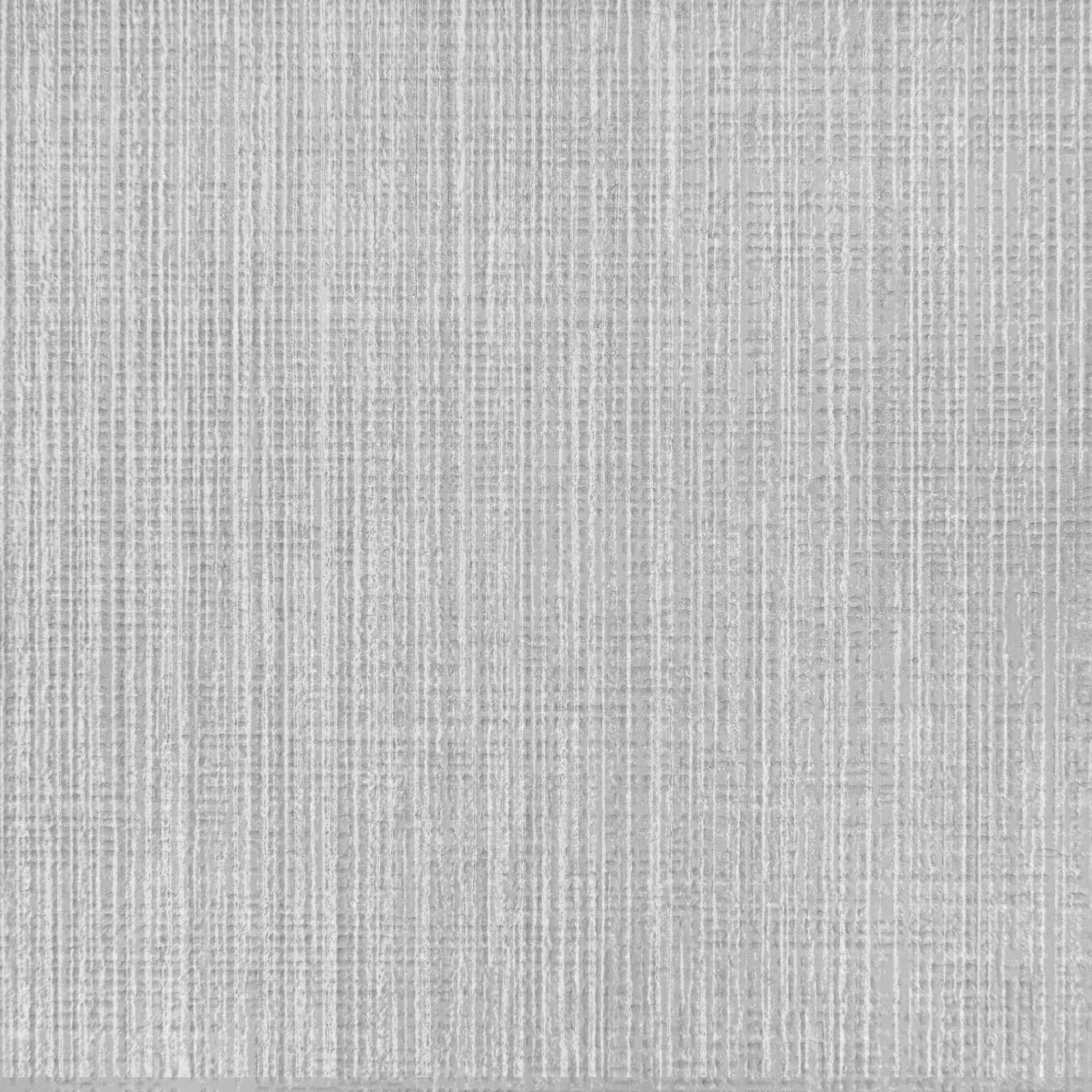 A Grey Woven Rug With A White Background