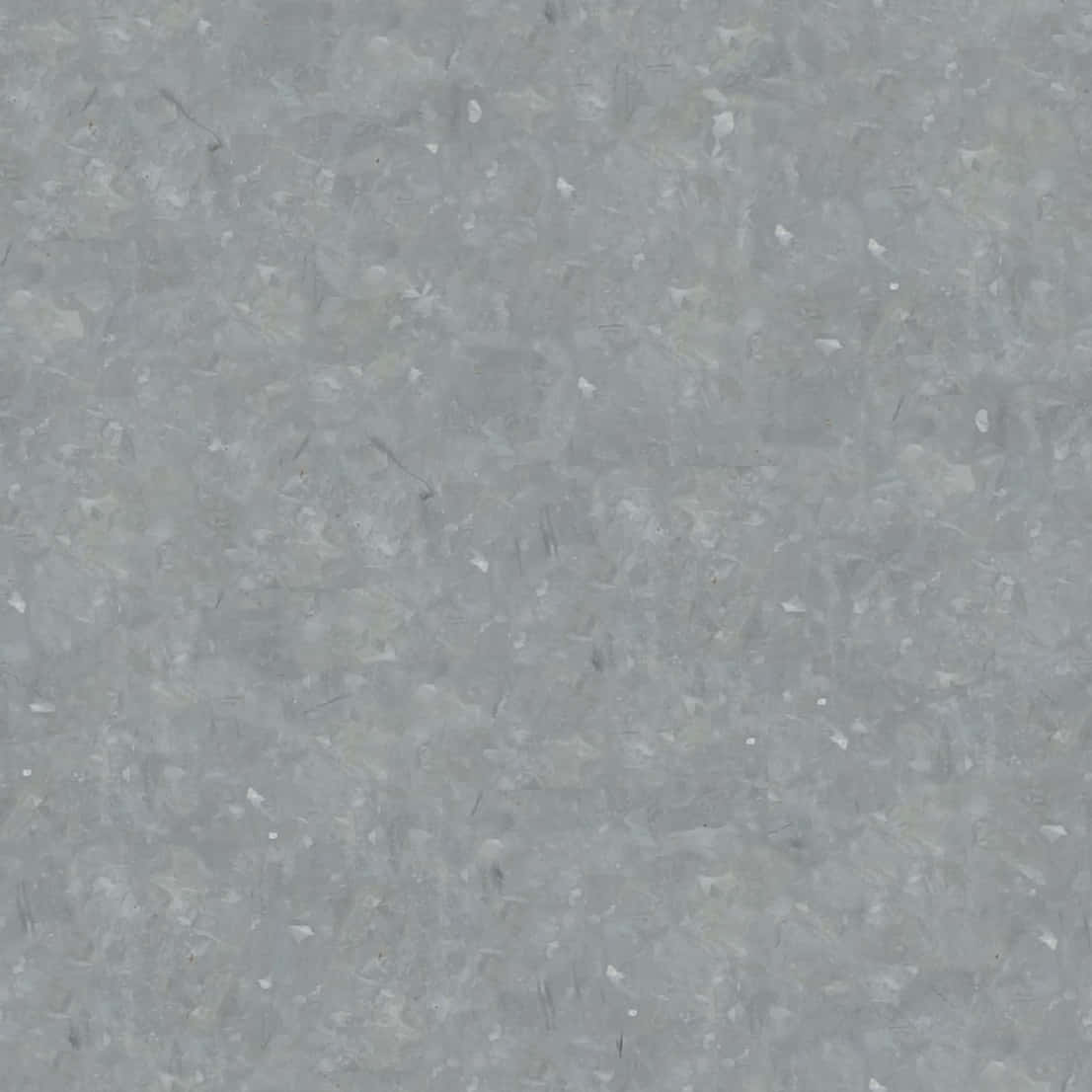 A Gray Background With A Few Small Stones