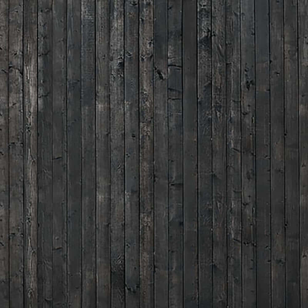 A Black Wooden Wall With A Lot Of Scratches