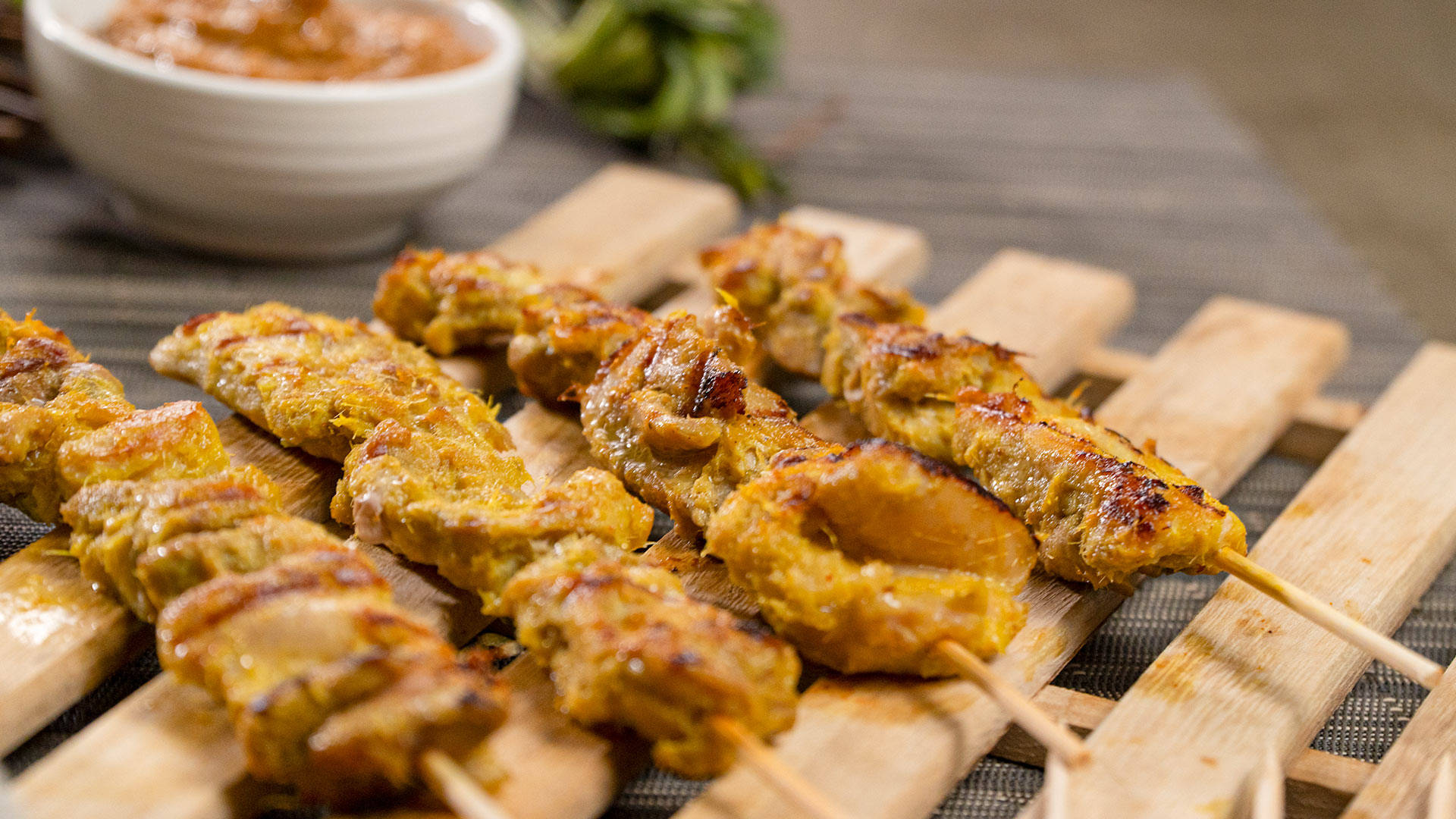 Delicious Grilled Chicken Satay with Tangy Peanut Butter Dipping Sauce Wallpaper