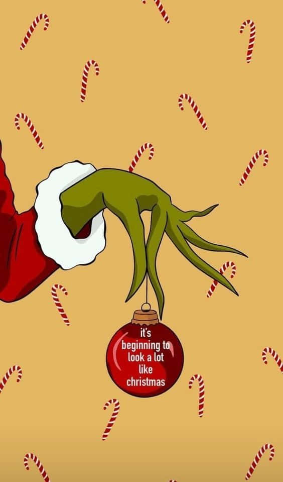 Genießensie Ihr Grinch-weihnachten Mit Einem Iphone. Wallpaper