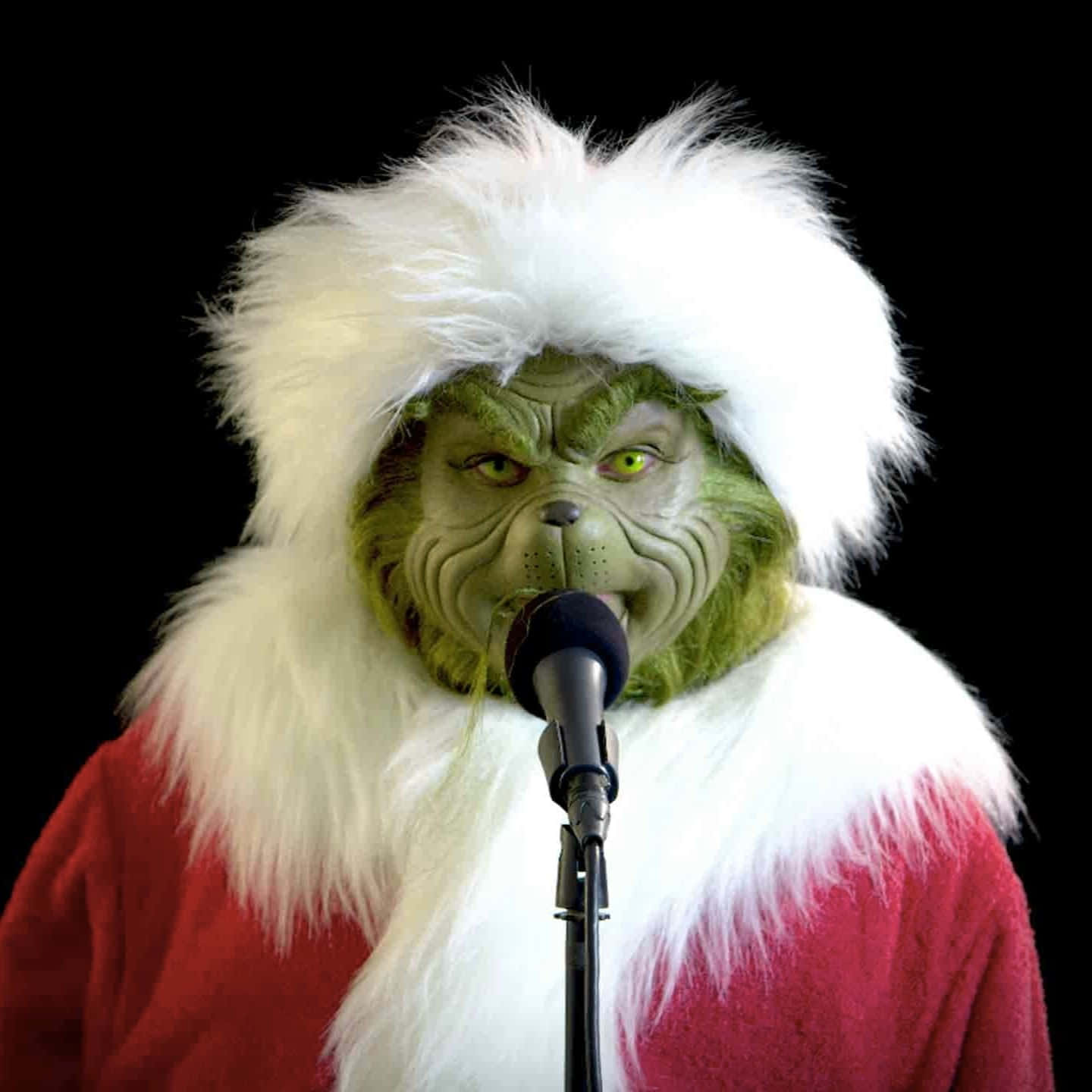 Grinch Costume Microphone Performance Wallpaper