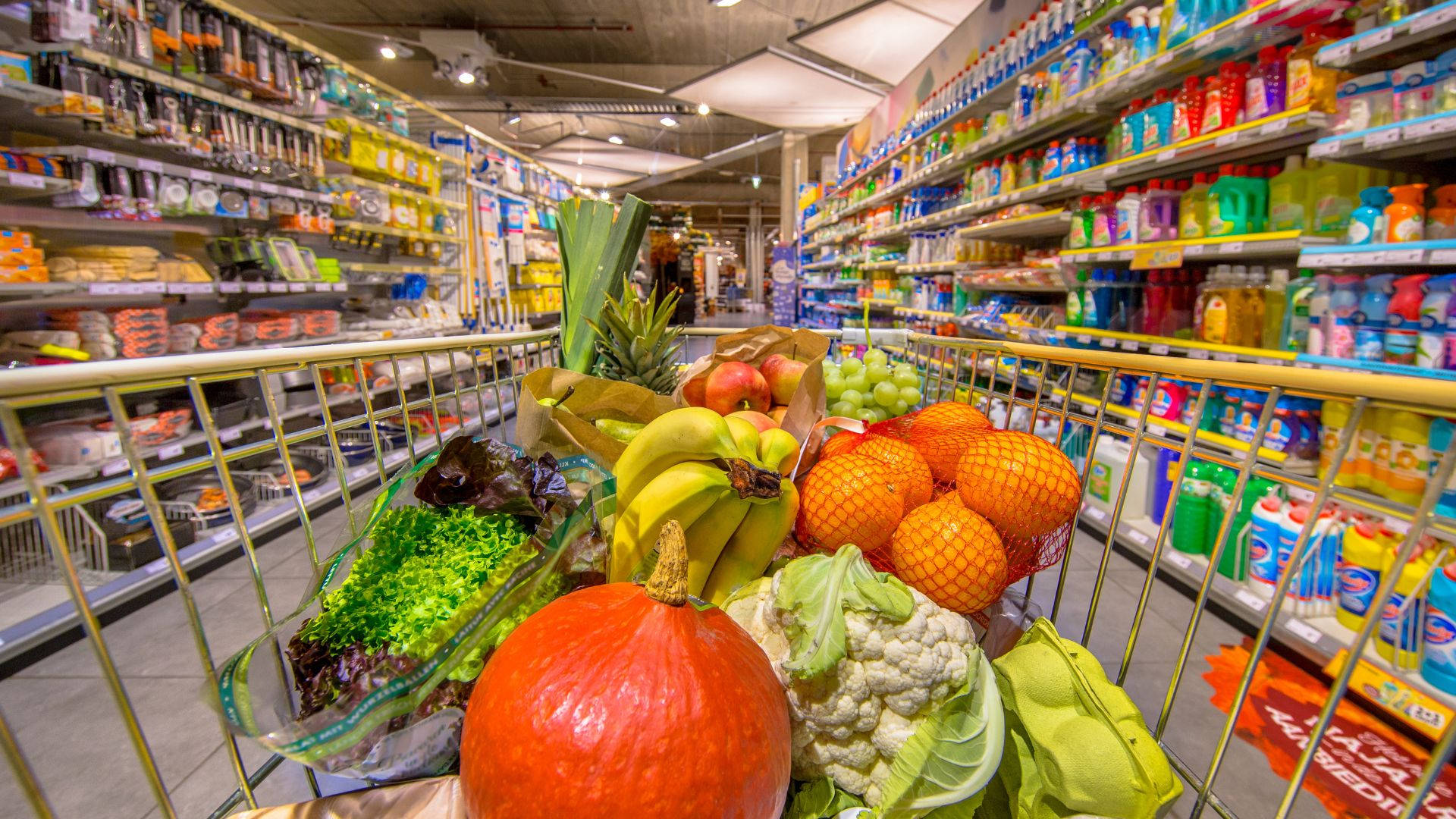 Fresh Assortment of Fruits and Vegetables in Grocery Store Wallpaper