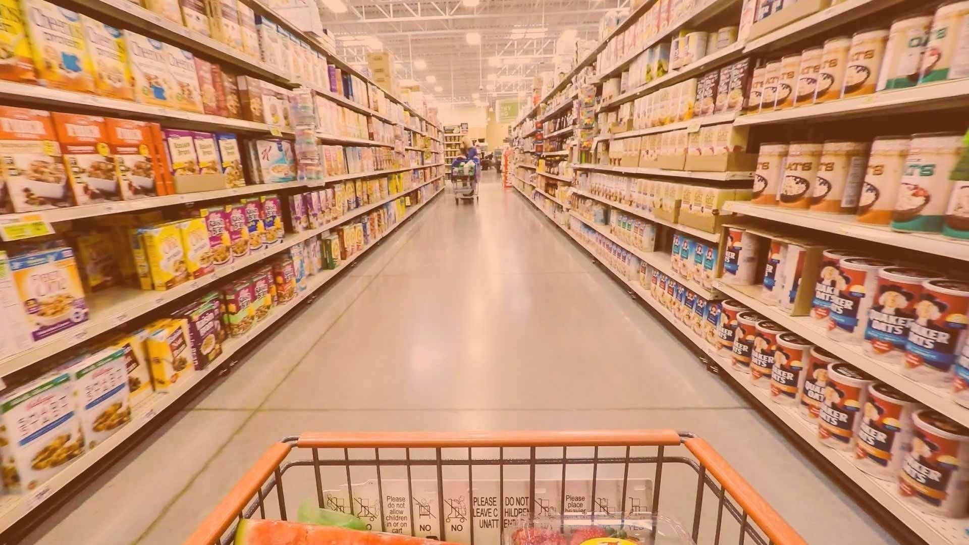 Grocery store shopping aisle with yellow filter Wallpaper