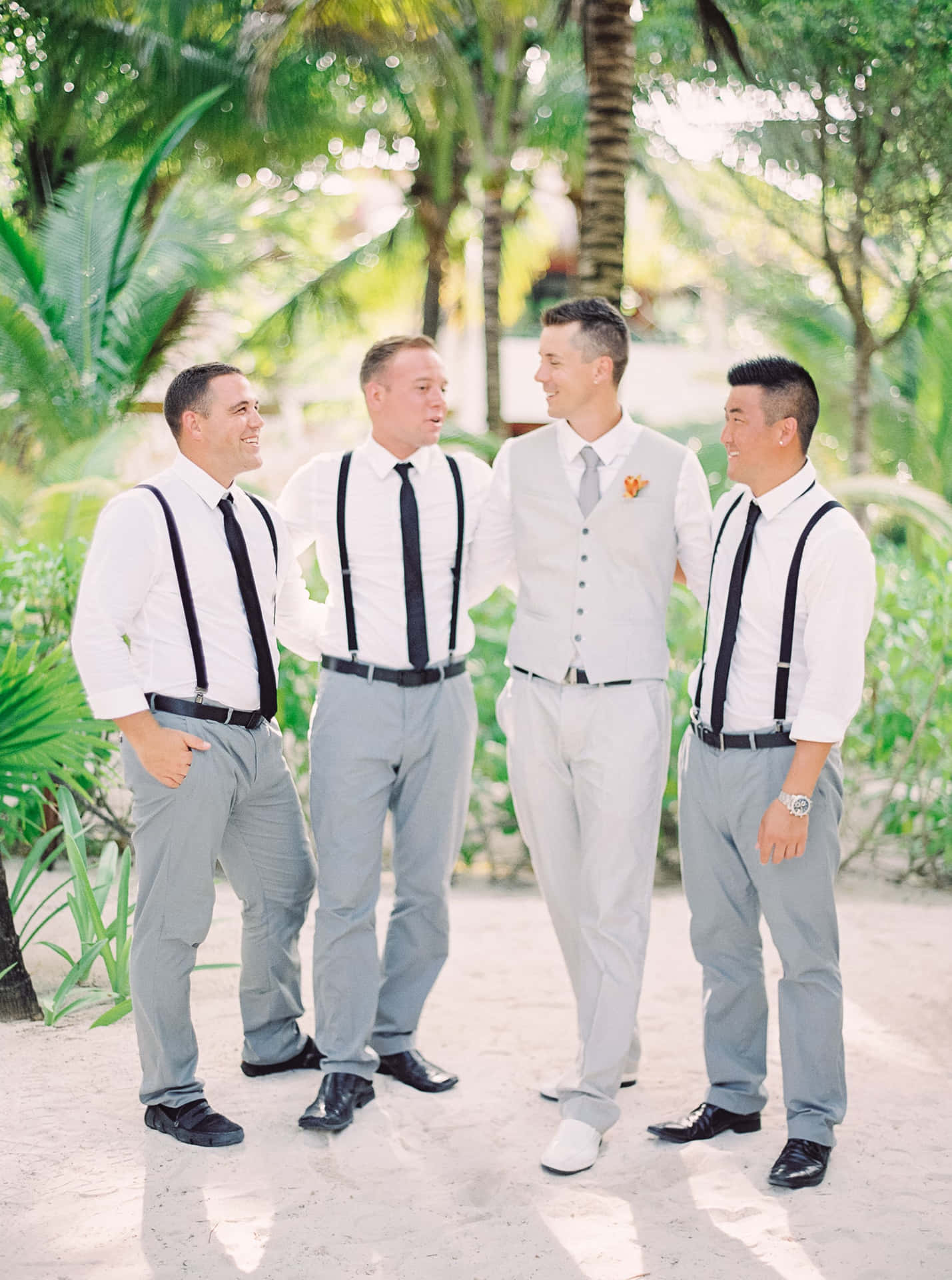 Groom and groomsmen in formal attire, ready to celebrate the special day!