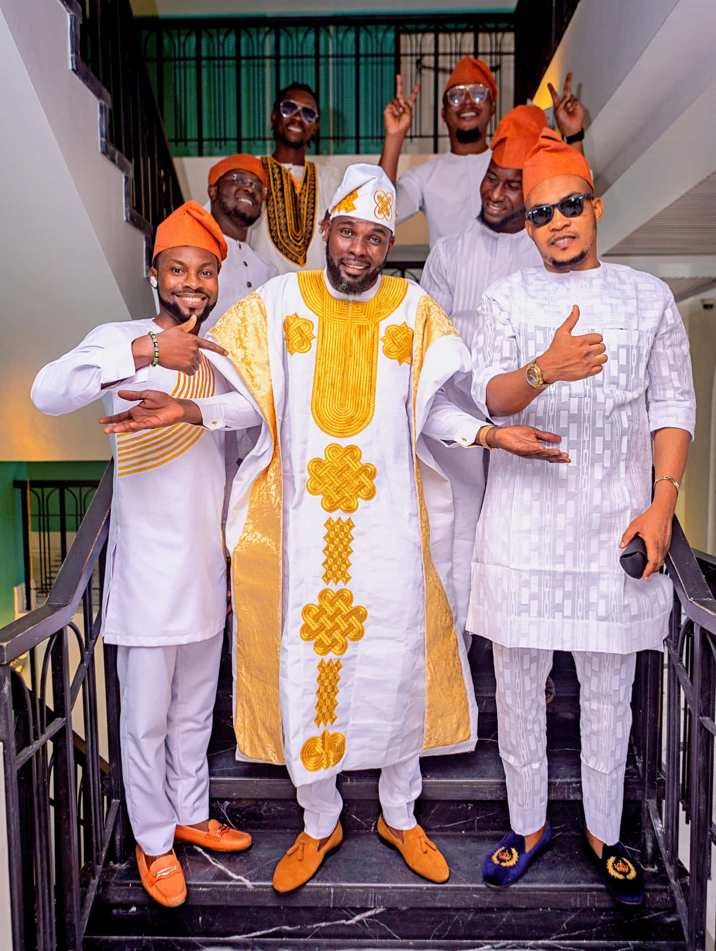 A Group Of Men In Traditional Attire Posing For A Picture