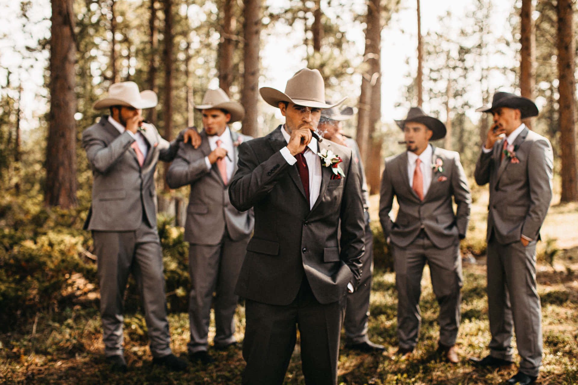 "Family First - A Groomsman, Groom and Father of the Groom Pose for a Loving Moment"