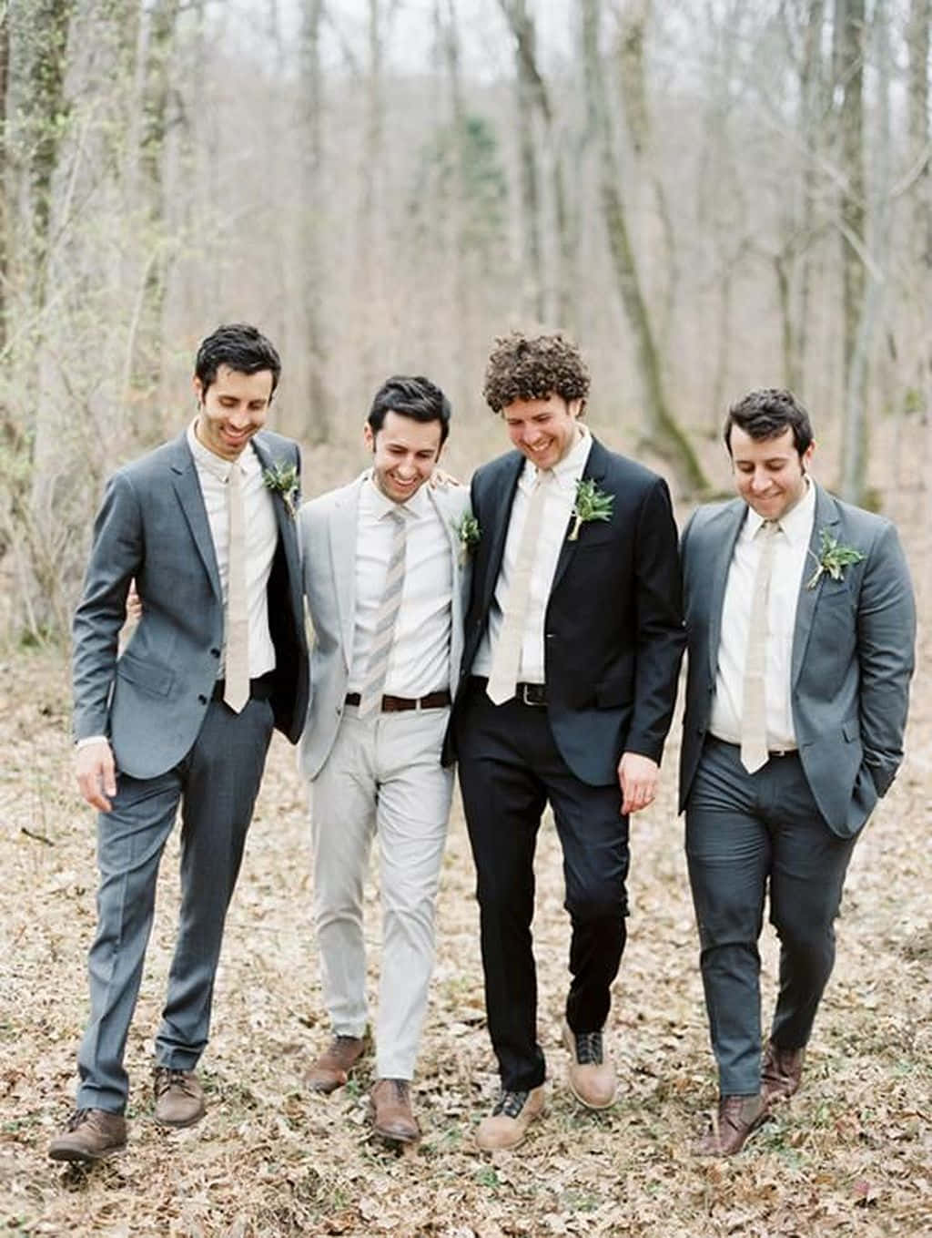 A group of happy groomsmen enjoying their special day.
