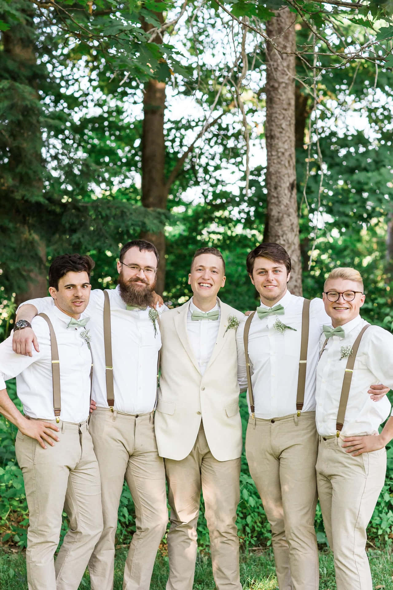 Groomsmen posing for a picture on the wedding day.