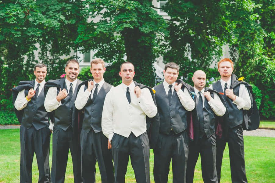 Groom and his groomsmen enjoy each other's company.