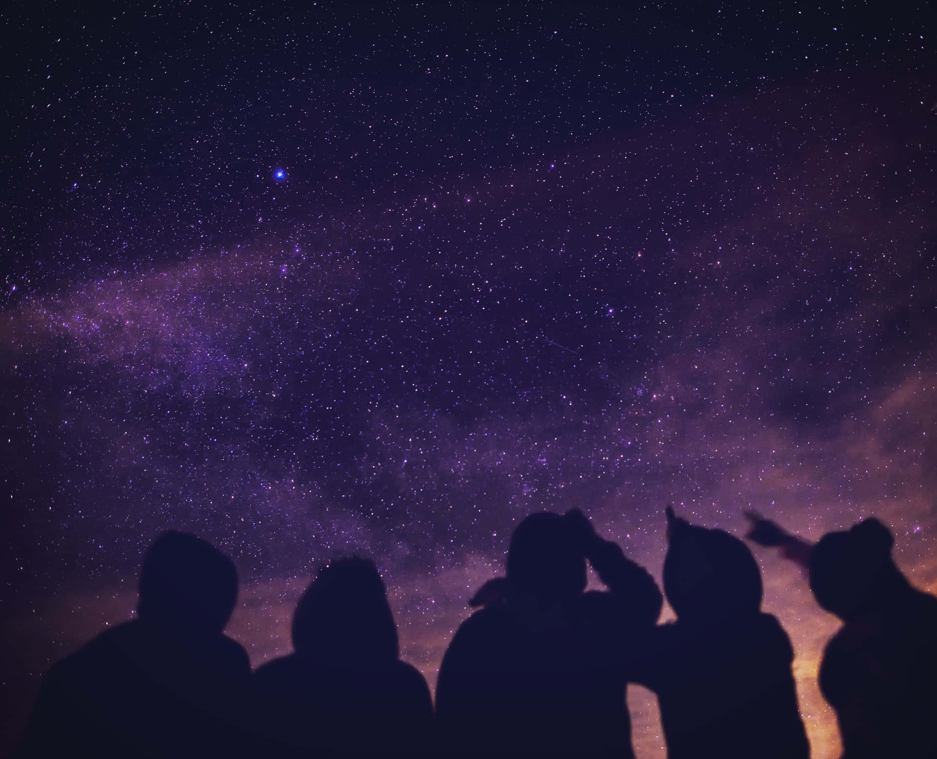 Group Of Friends Pointing At The Stars Wallpaper