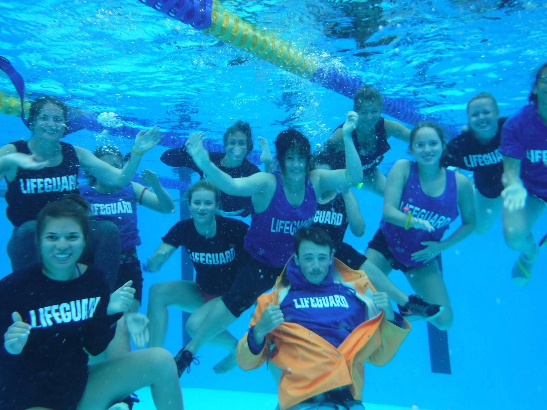 A Team of Lifeguards Underwater Training Wallpaper