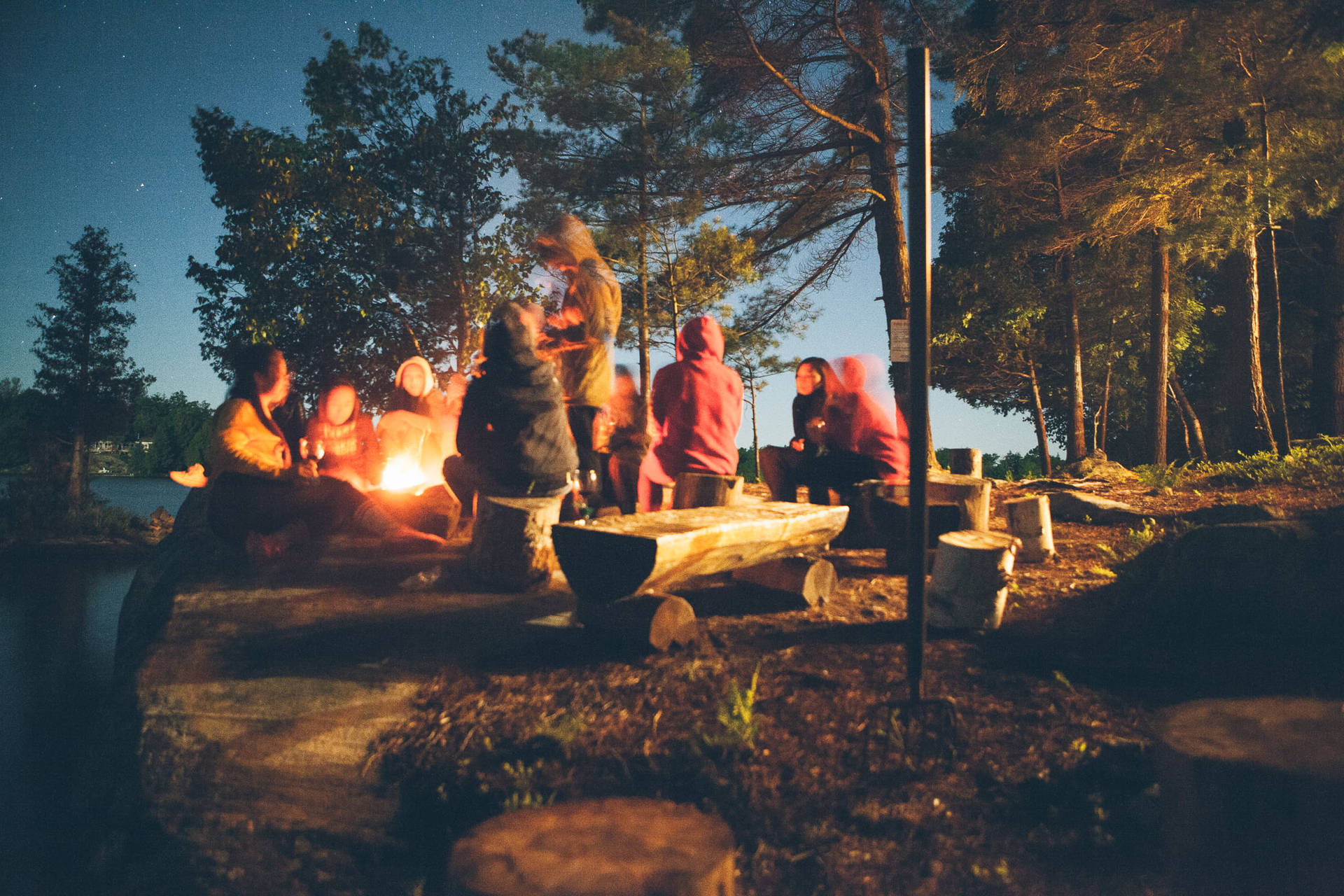 Group Of People Camping Together Wallpaper