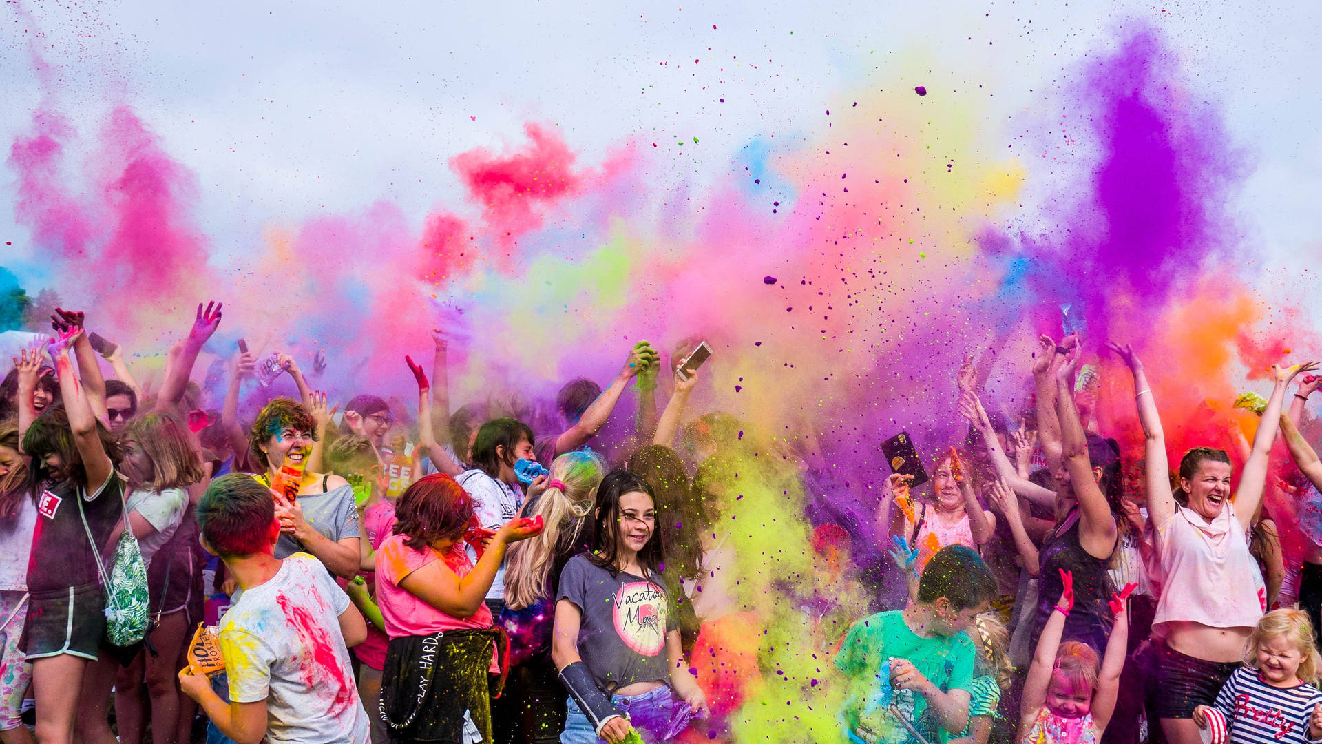 Group Of People In A Color Run Wallpaper