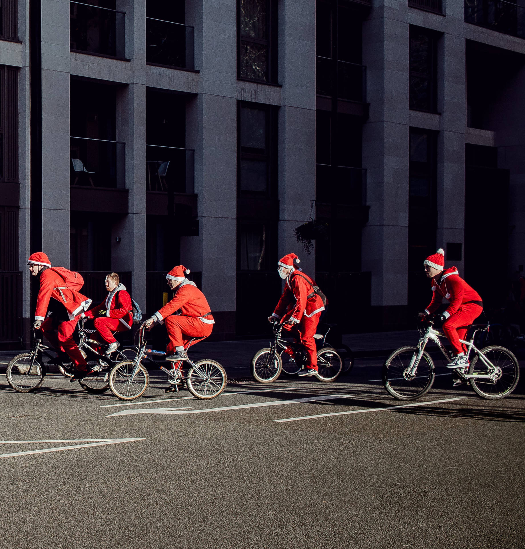 Group Of People In Santa Costumes Background