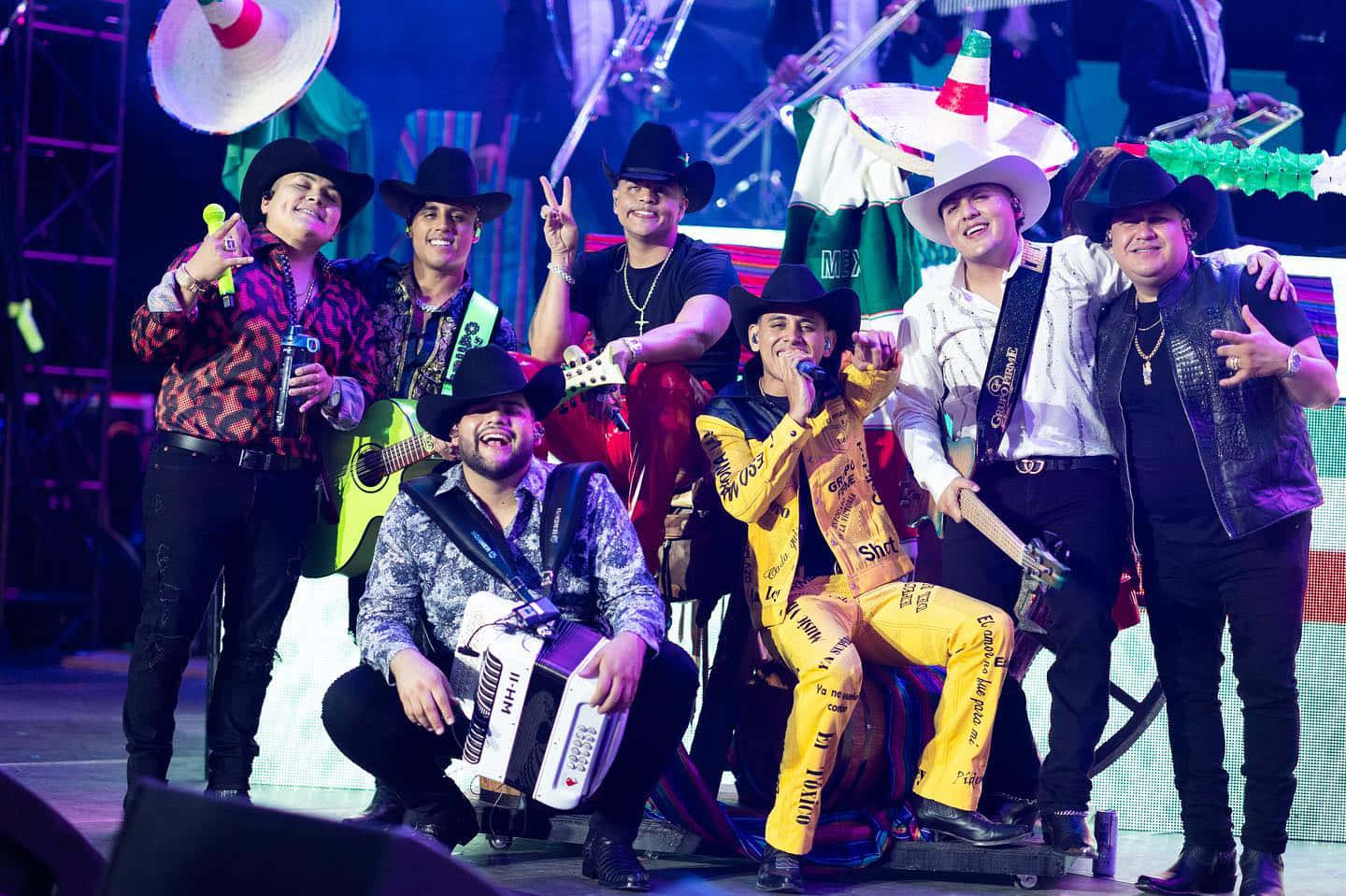 A Group Of Men In Hats And Costumes Posing For A Photo Wallpaper