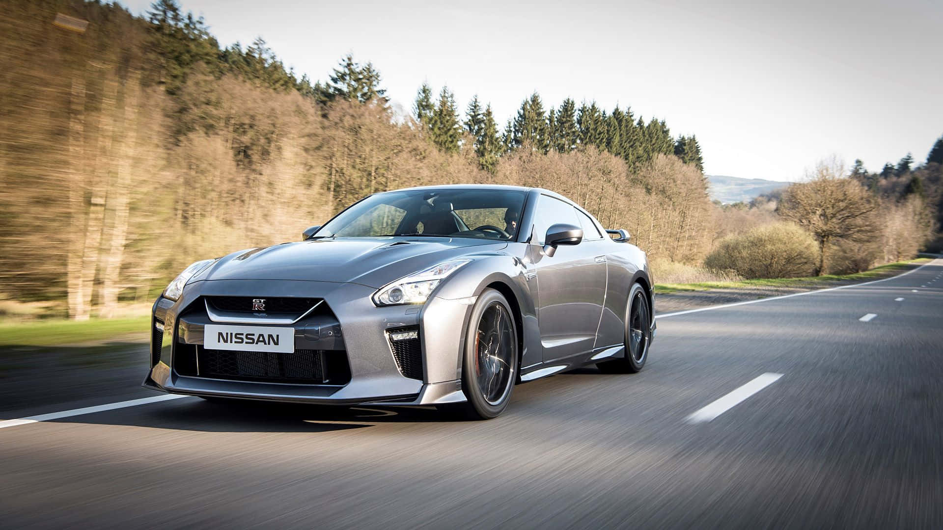Image  A Red Nissan GTR Racing Through The Streets
