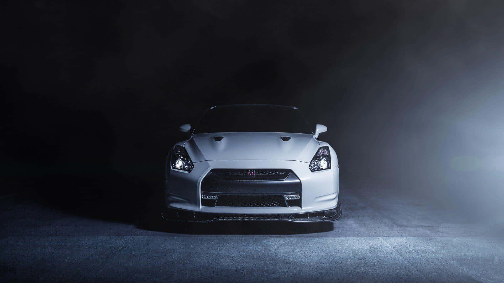 Get The Thrill Of A Lifetime Behind The Wheel In A Nissan Gtr. Wallpaper