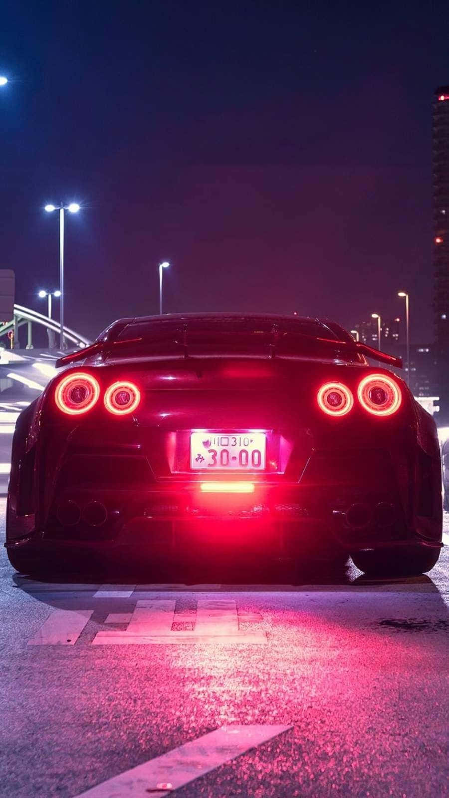 Get behind the wheel with the sleek and powerful GTR Iphone Wallpaper