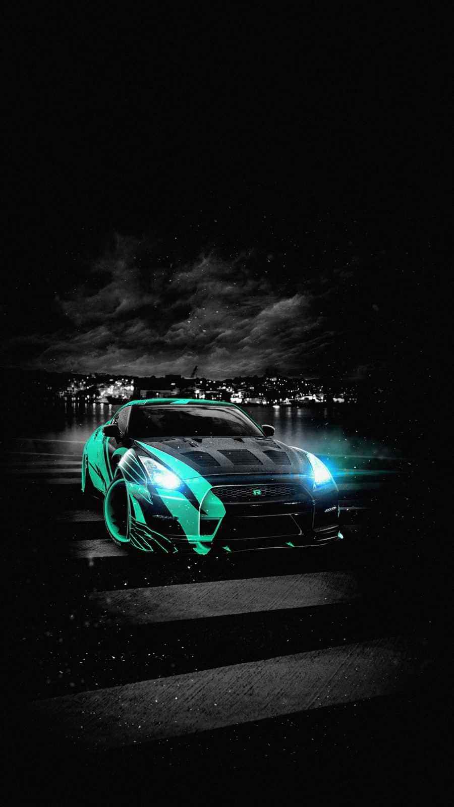 A Car Is On The Road At Night Wallpaper