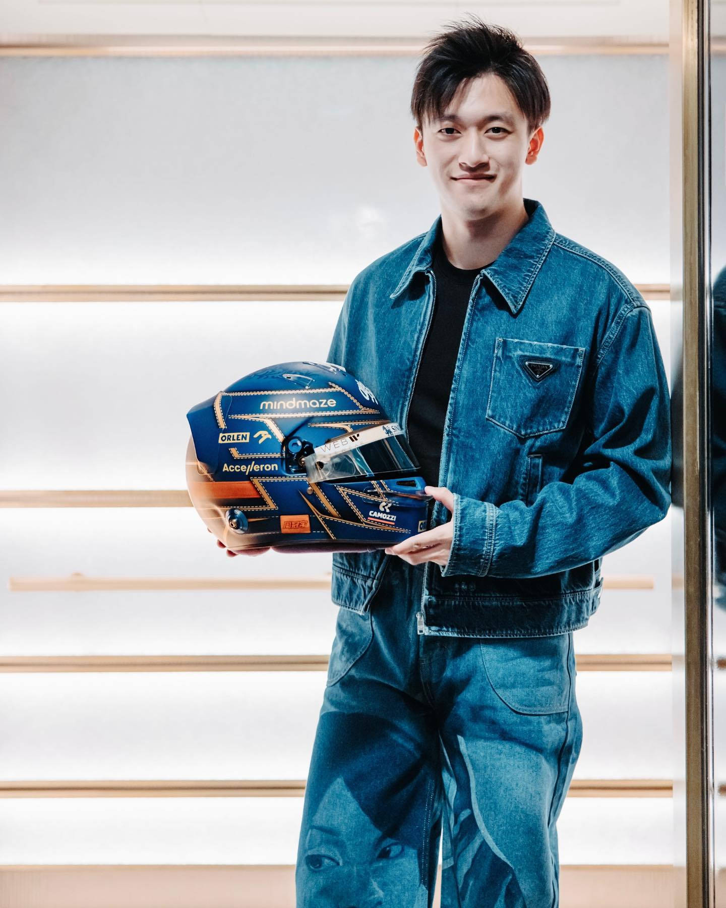 Caption: Guanyu Zhou in stylish denim wear on a casual day out Wallpaper