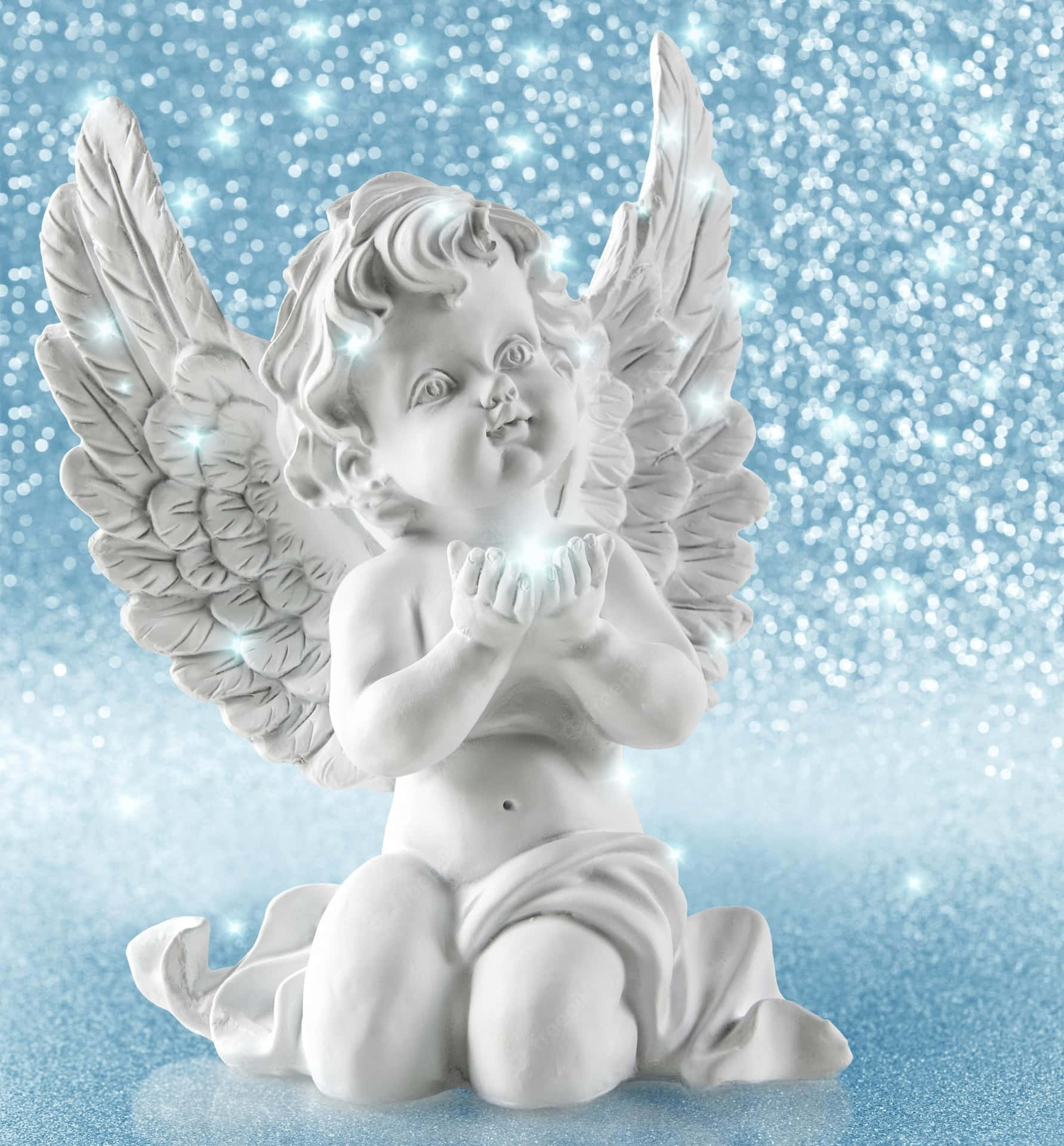 A White Angel Figurine Is Sitting On A Blue Background Wallpaper