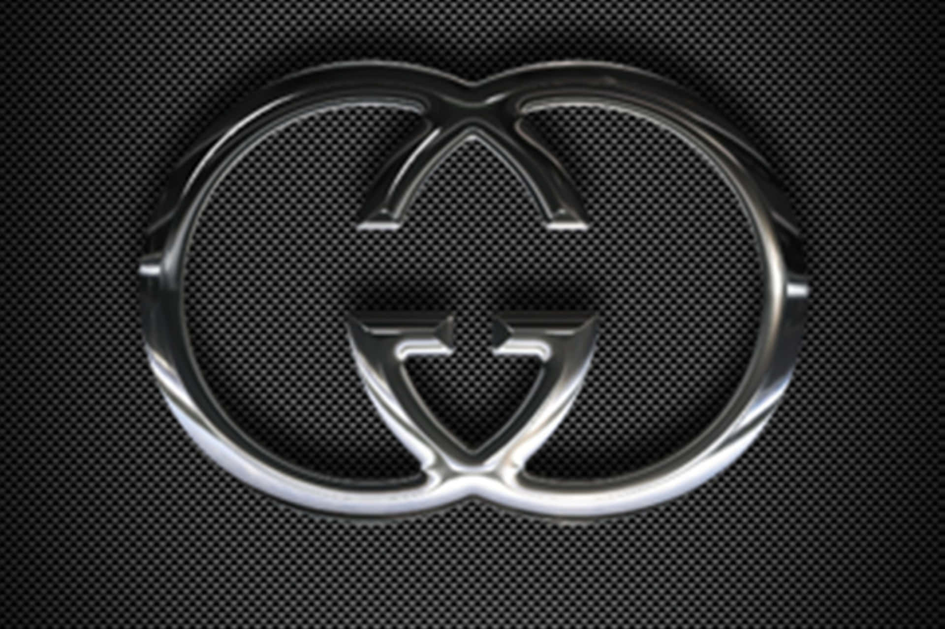 Förstklassigbakgrund Med Guccis Logotyp I Silverfärg.