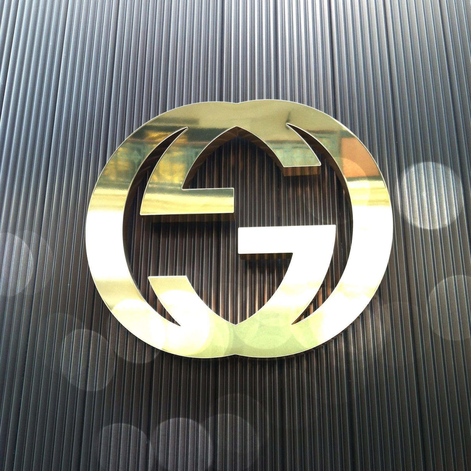 Lyxigguldig Gucci-logobakgrund