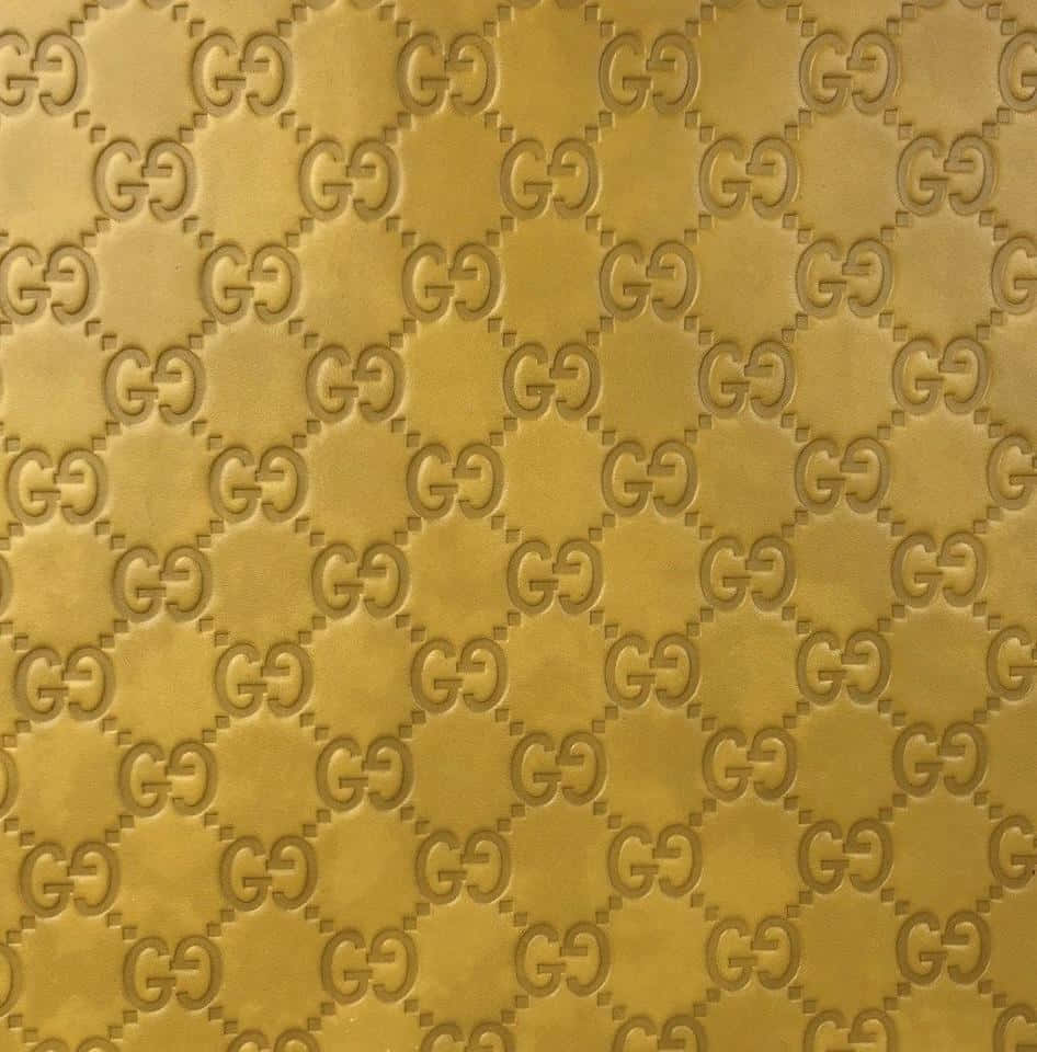 Enkelgold Gucci-mönsterbakgrund