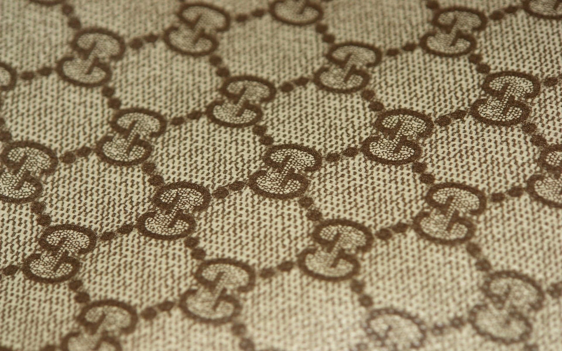 Elegantbrun Gucci-mönsterbakgrund