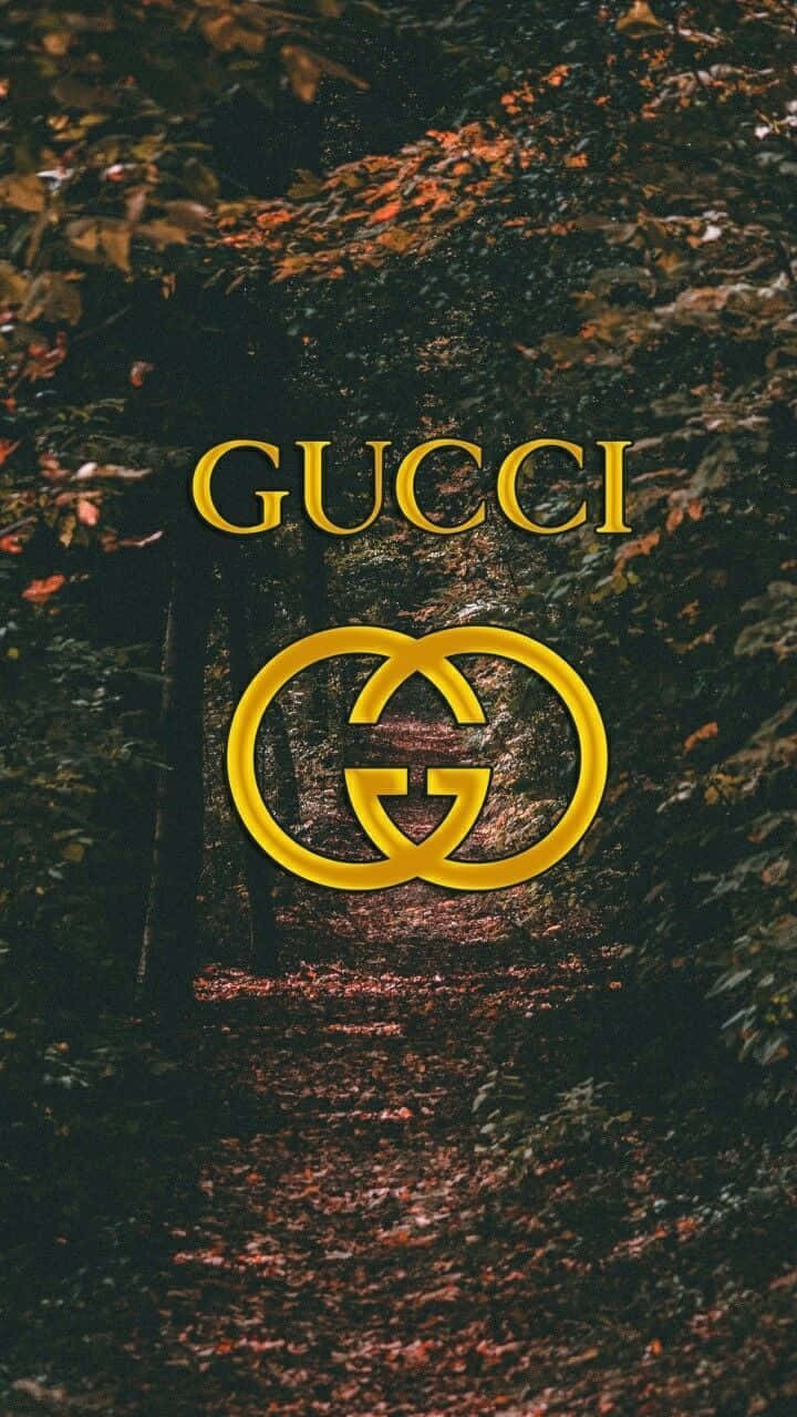 Fondoatractivo Con El Logo Y Texto Dorado De Gucci