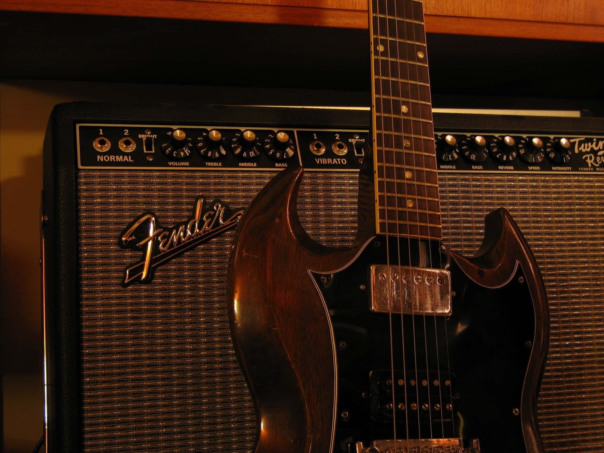 Get ready for the ultimate musical experience with this powerful Guitar Amp Wallpaper