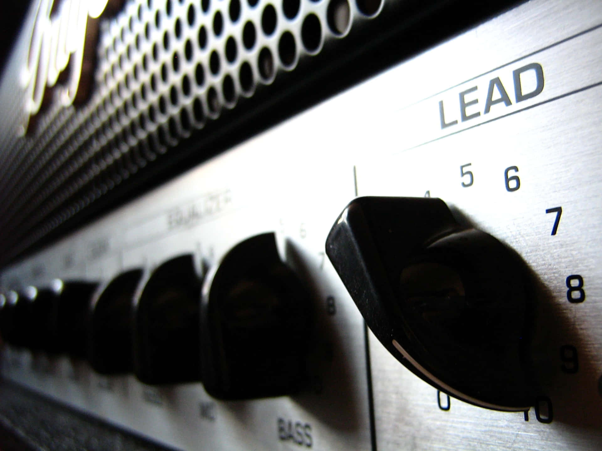 A Black And Silver Guitar Amplifier Wallpaper