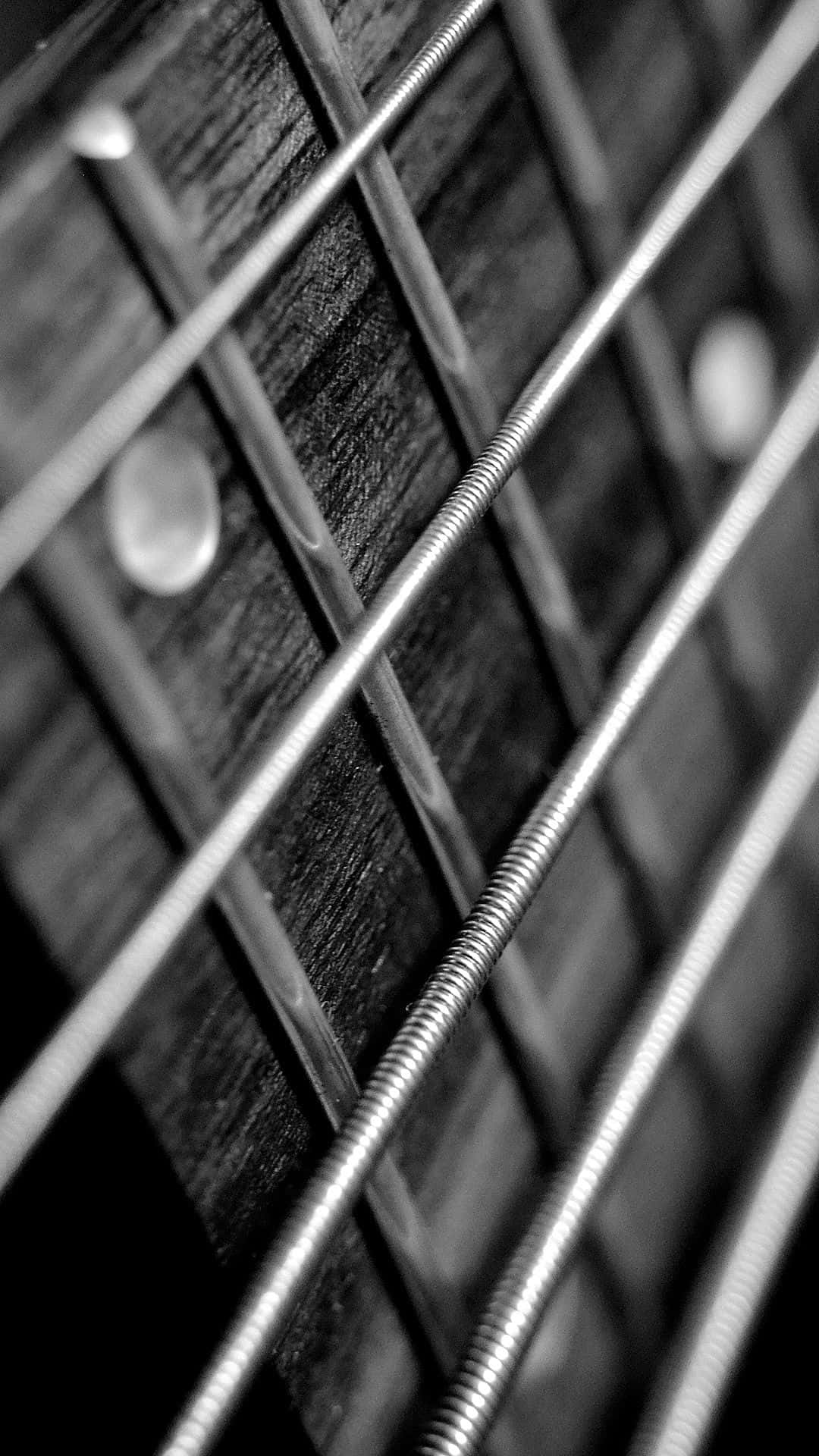 Schwarzweißes Foto Einer Gitarrensaiten