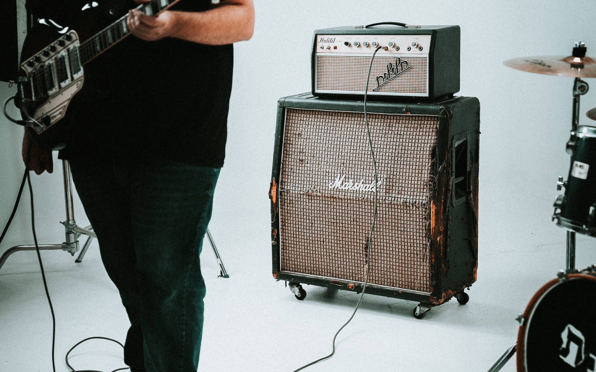 Guitarist Using Marshall Amplifier Wallpaper