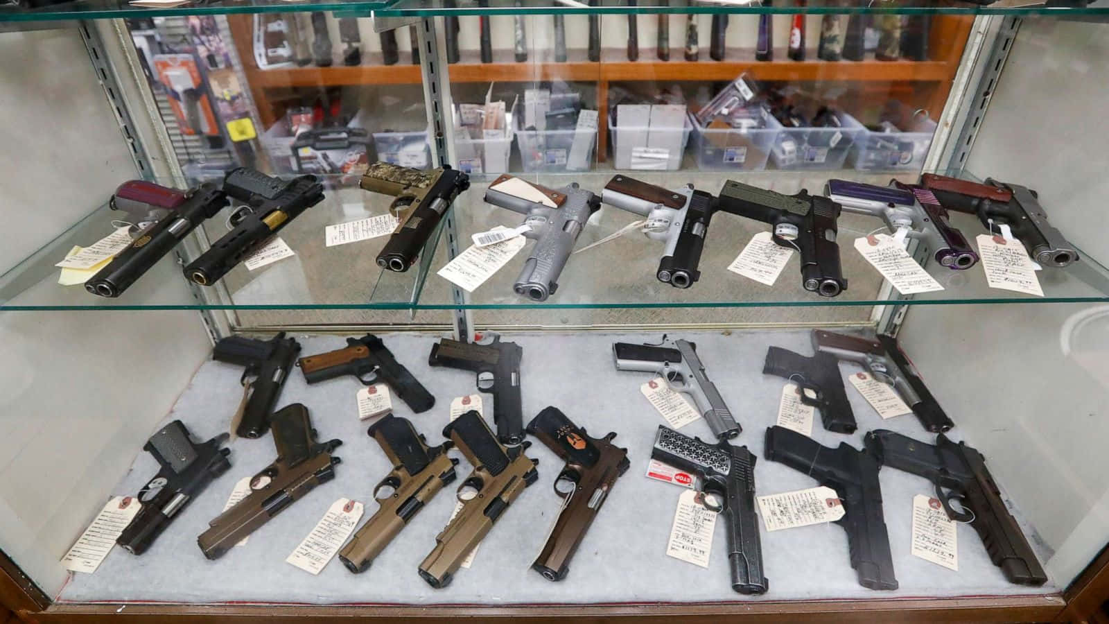 A Display Of Guns In A Glass Case