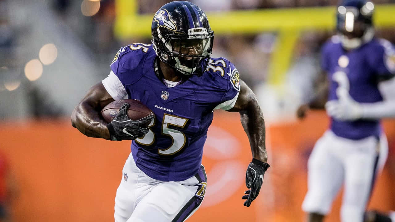 Gus Edwards Baltimore Ravens Running Back Action Wallpaper