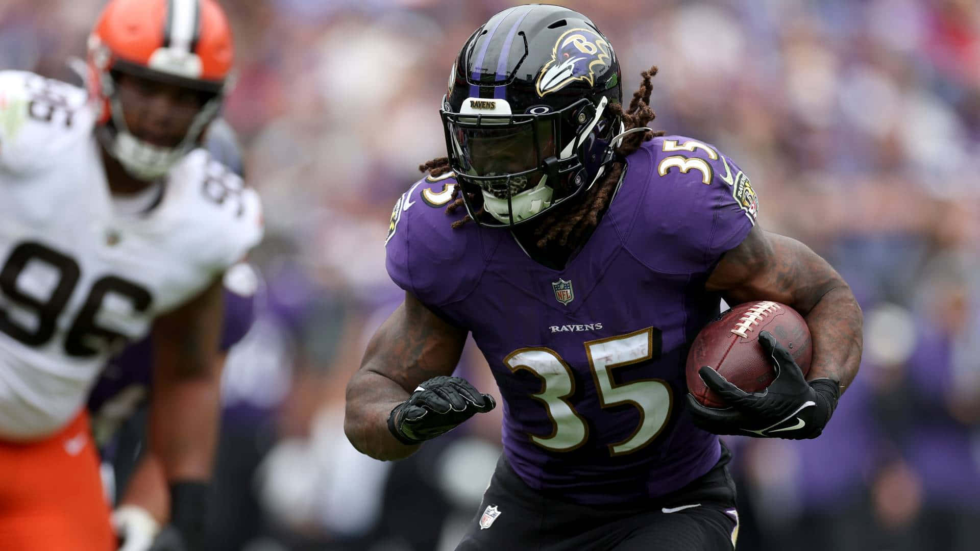 Gus Edwards Ravens Running Back Action Wallpaper