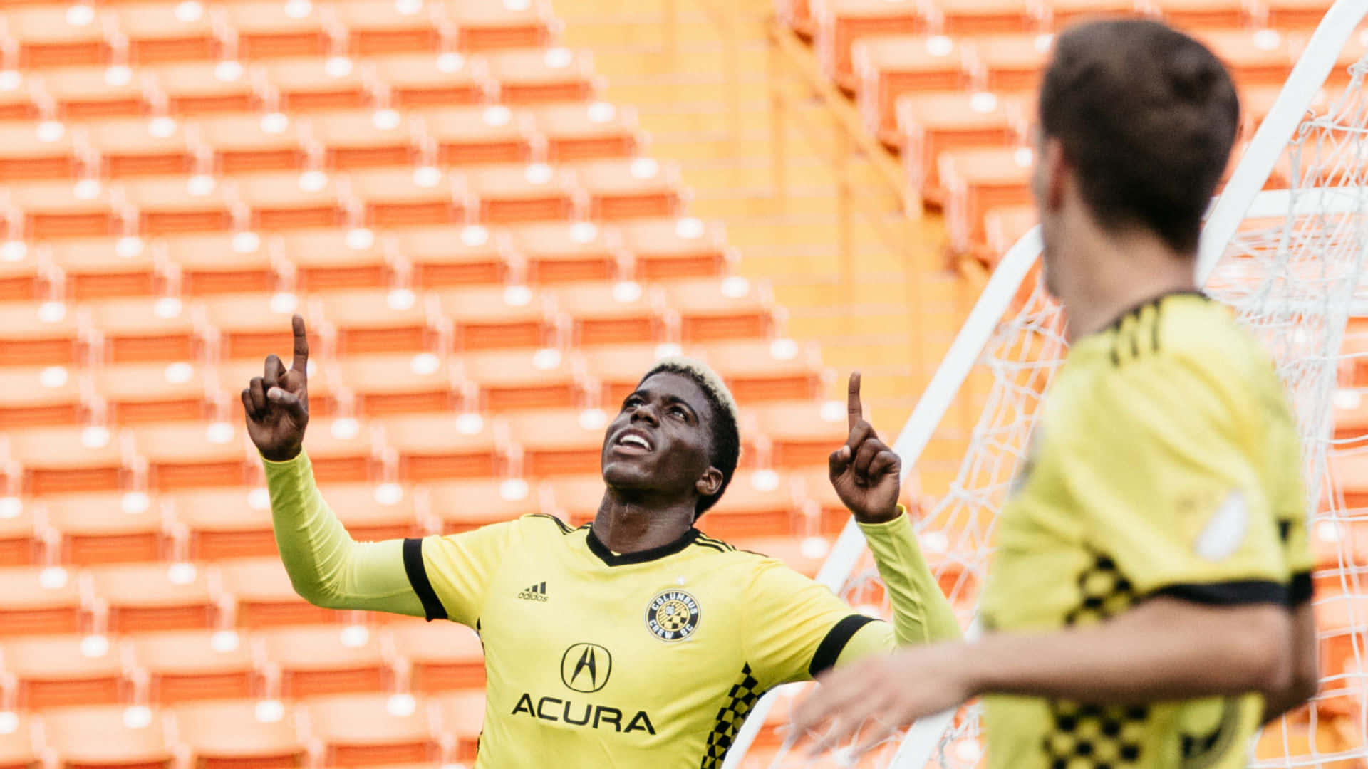 (context: This Could Be A Potential Caption For A Wallpaper Featuring Gyasi Zardes Of Columbus Crew, Pointing Upwards.) Wallpaper