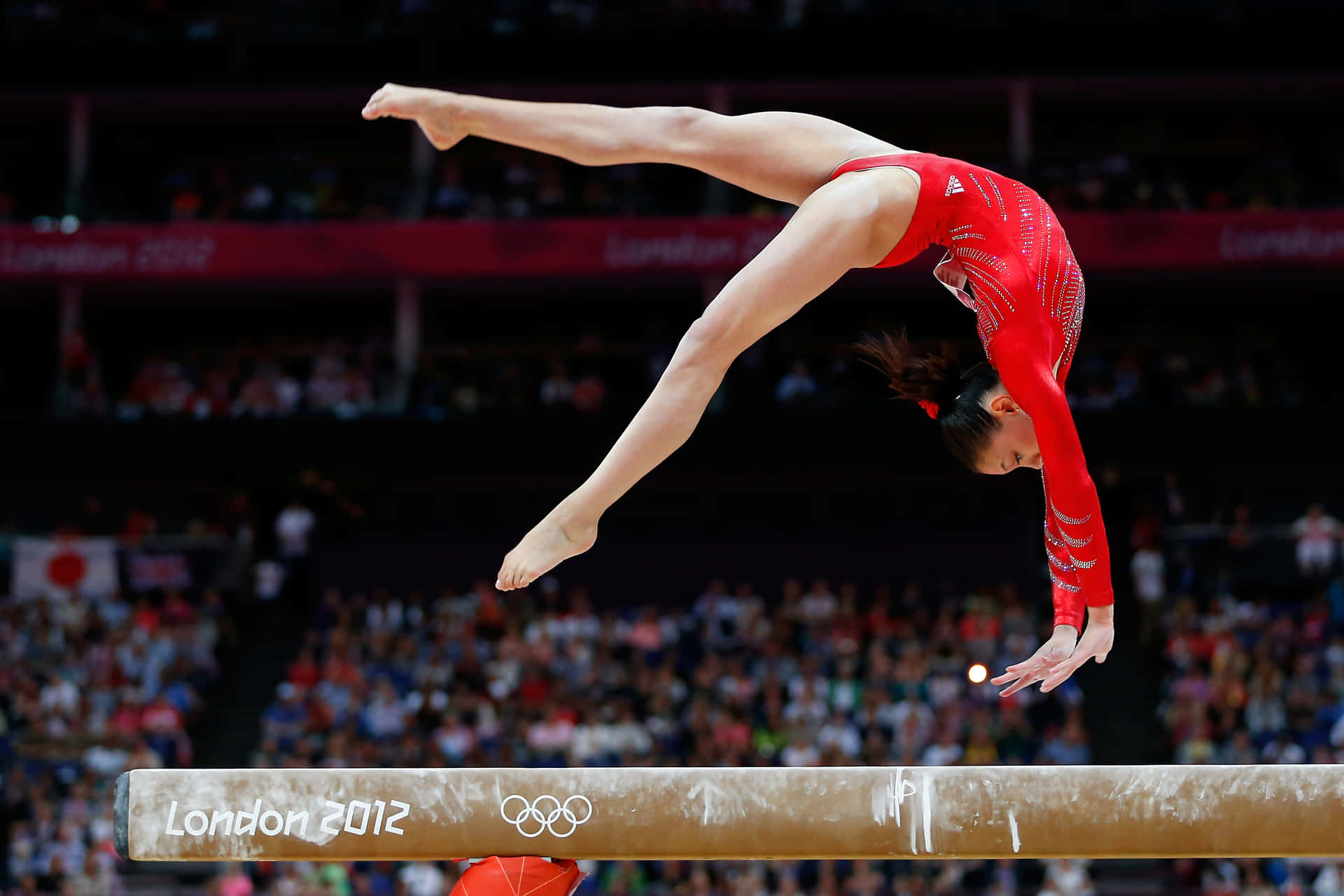 Gymnast Perfecting Her Balance Beam Routine