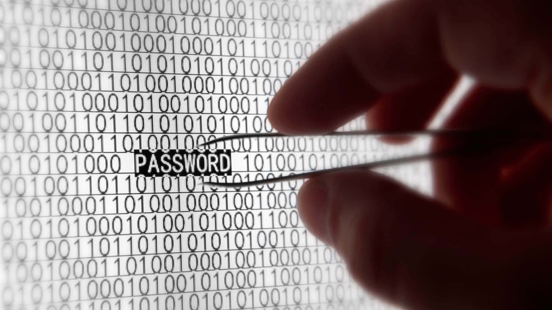 A Person Is Holding A Pair Of Scissors And Typing Password