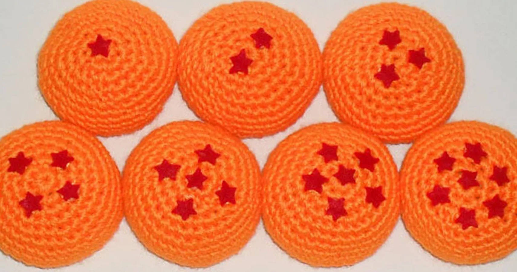 Hacky Sack Crochet Orange stjerner på en blå baggrund Wallpaper