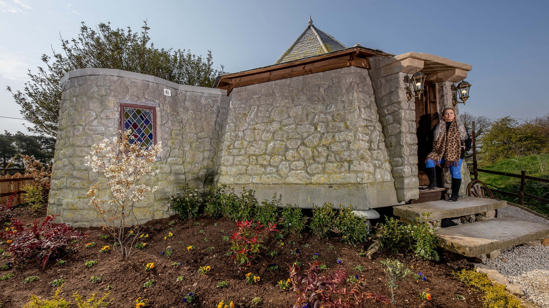 Enchanting view of Hagrid's Hut in the magical world of Hogwarts Wallpaper