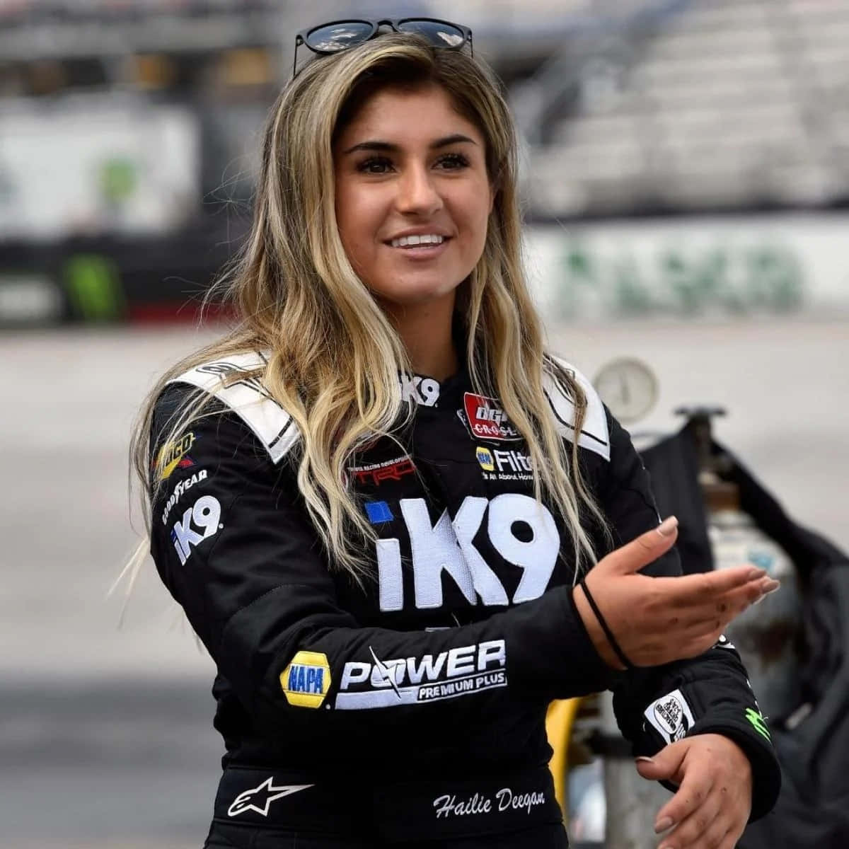 Download Hailie Deegan Racing Driver Portrait Wallpaper | Wallpapers.com