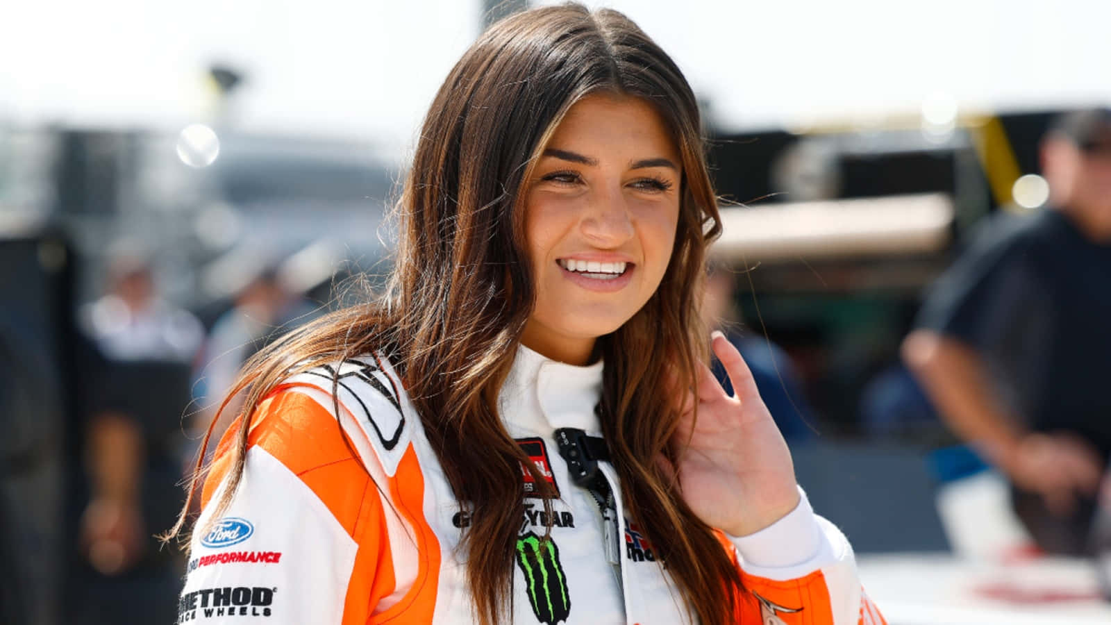 Hailie Deegan Smiling Racetrack Wallpaper